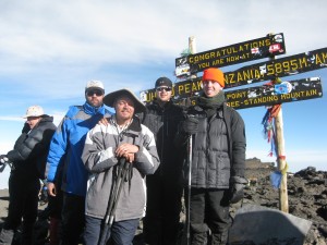 Sensei Mike and his sighted guides on top of Mt. Kilimanjaro